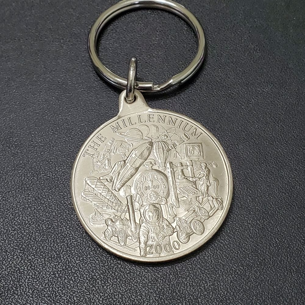 Avon silver tone millennium coin key ring collectible